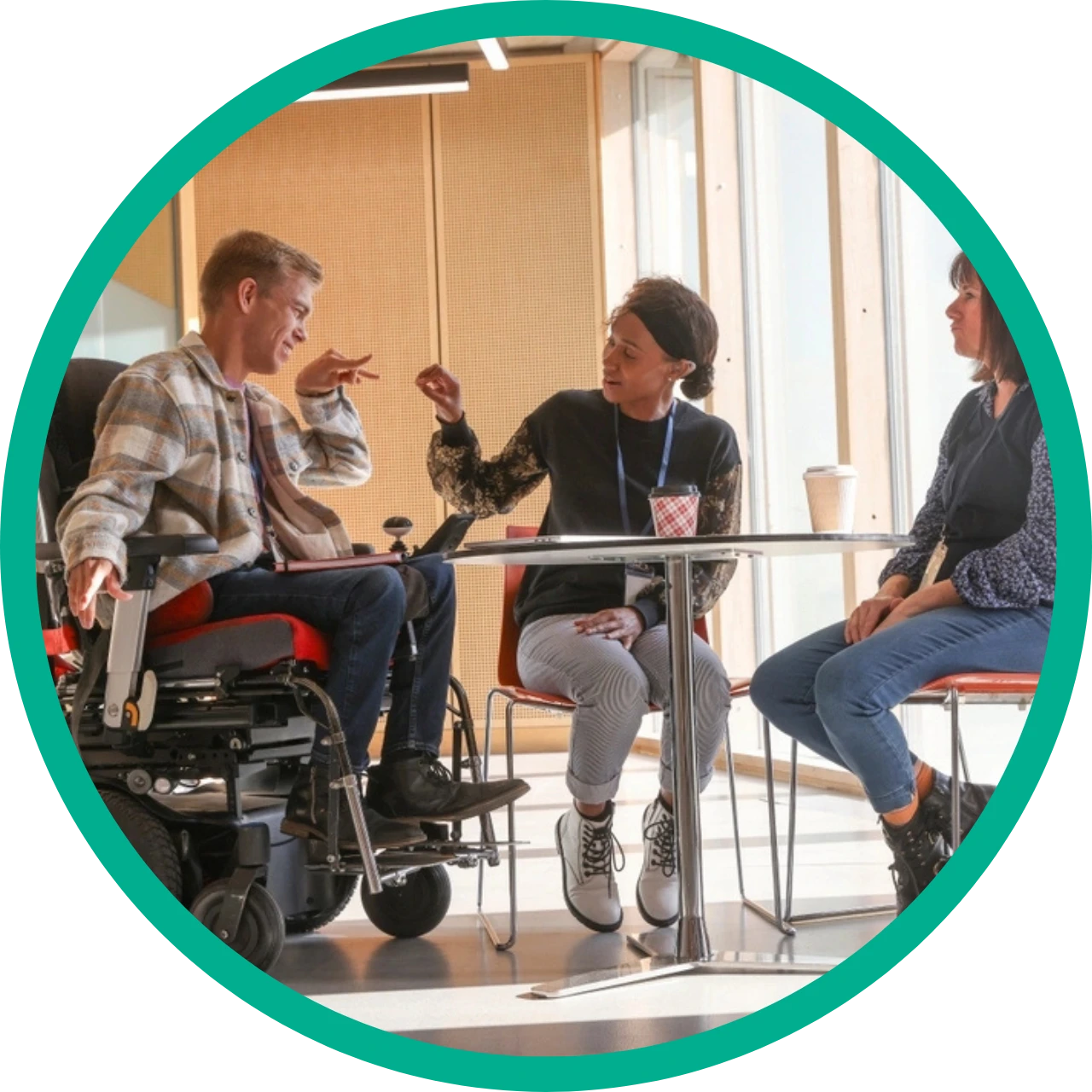 Disabled men on wheelchair high-fiving a friend
